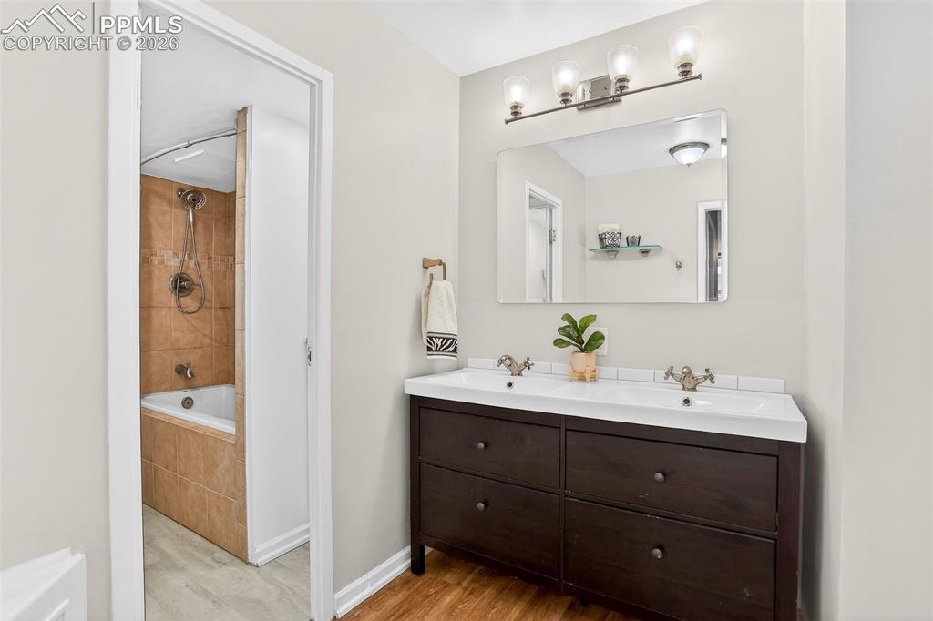 Image 15 of 25: Bathroom, remodeled, Lage spa tub/shower combo, additional storage cabinet