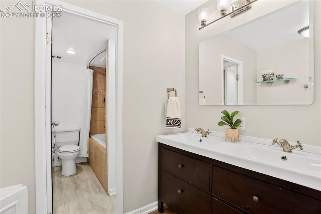 Image 16 of 25: Bathroom, two separate rooms, double sinks