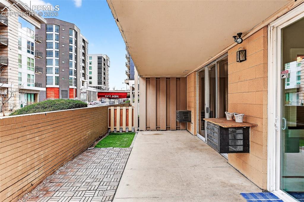 Image 18 of 25: Patio, extra large with privacy wall, looking south