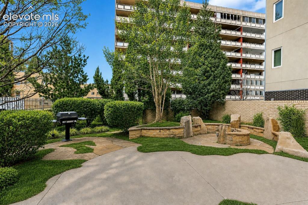 Image 20 of 25: View of Firepit and Grills in secured Pool area (enhanced photo)