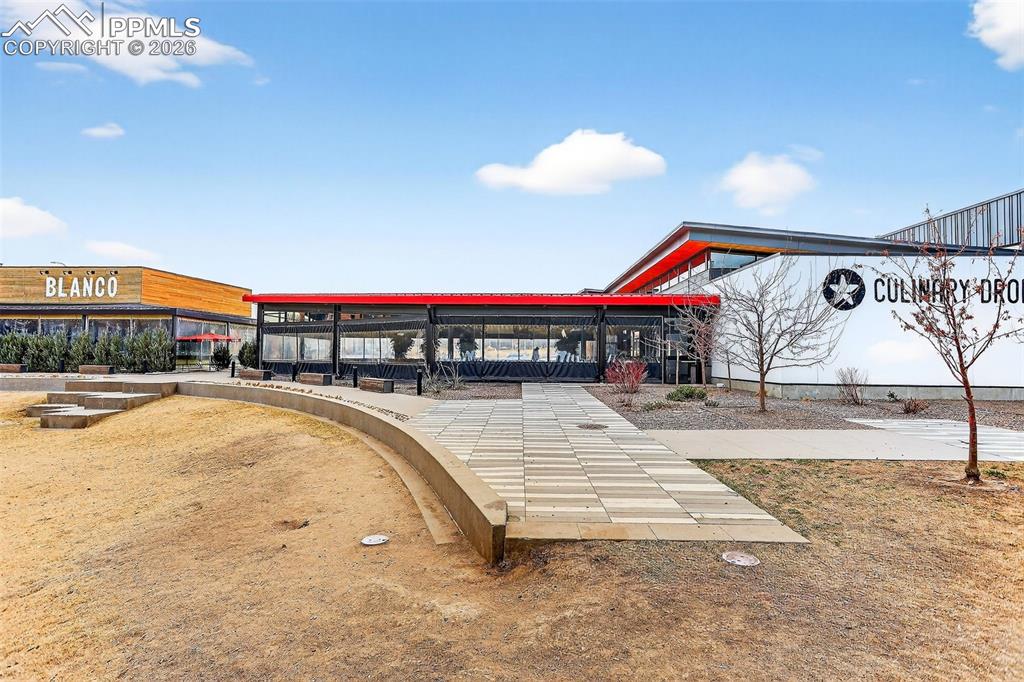 Image 25 of 26: Nearby area for pets to gather adjacent to restaurants, 9th & Co area