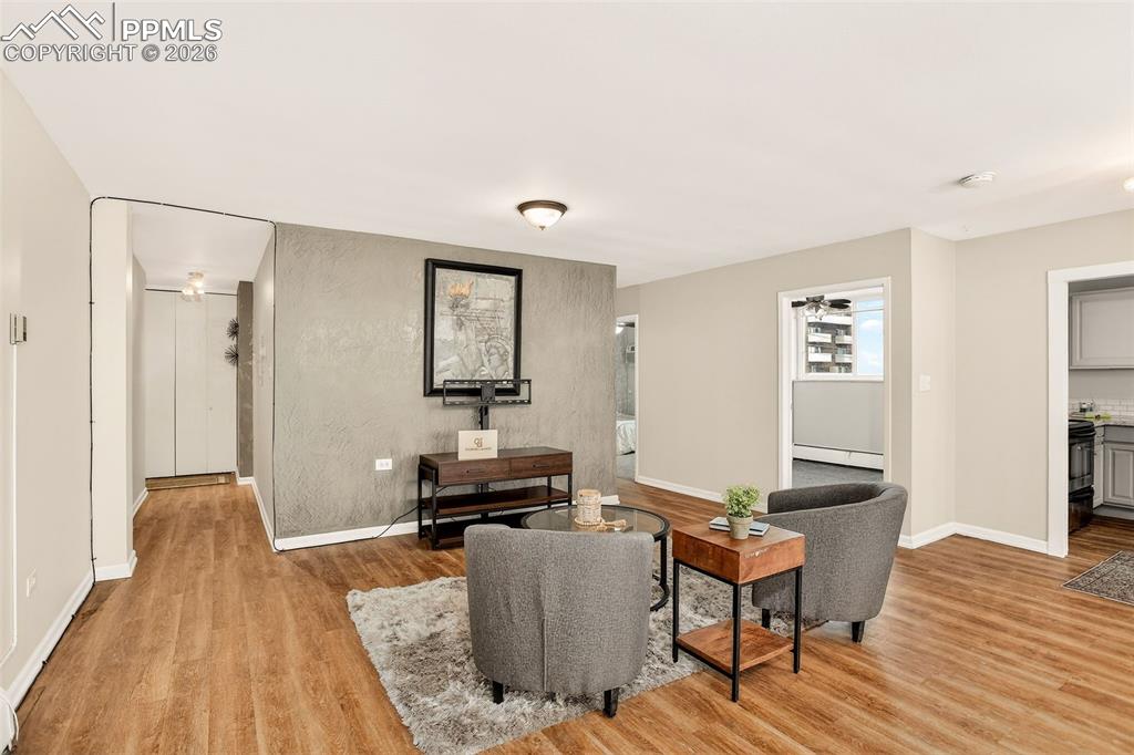 Image 7 of 26: Open concept main living area, custom venetian plaster accent wall