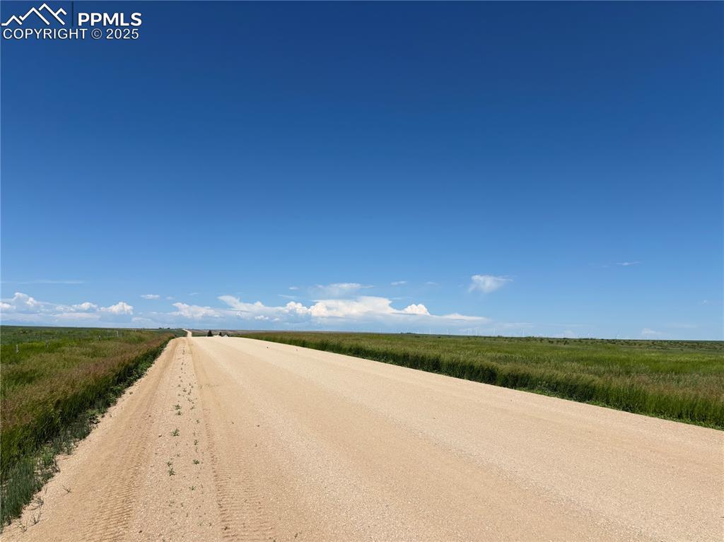 Image 2 of 7: View of dirt / gravel road with a view of rural / pastoral area