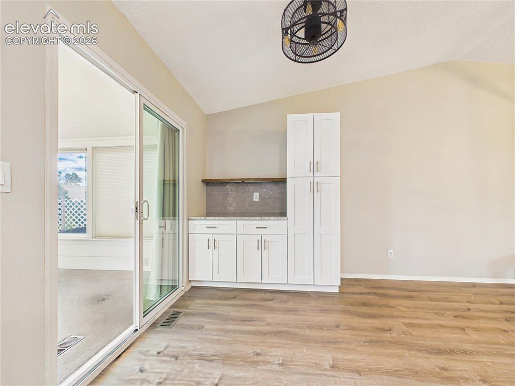 Image 12 of 50: Kitchen & Coffee Bar – Flexible kitchen space with extra cabinetry, built-i