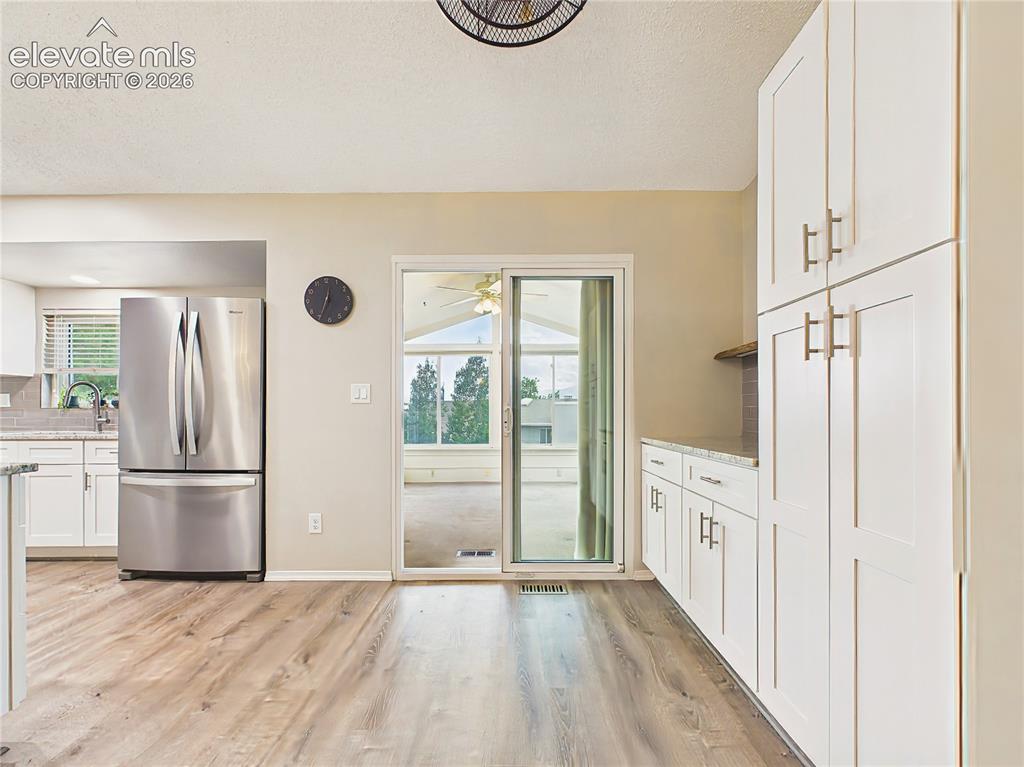 Image 14 of 50: Generous pantry-style cabinetry and additional counter space provide excell
