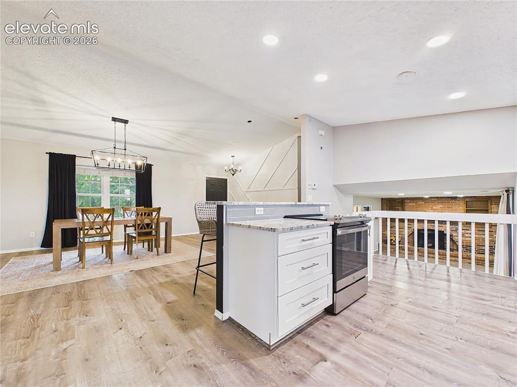 Image 16 of 50: Open-concept kitchen overlooks the adjacent living spaces, enhancing connec