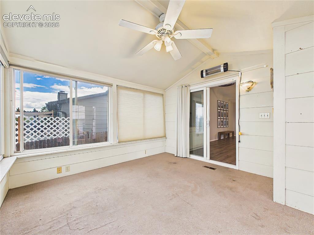 Image 21 of 50: Versatile enclosed sunroom with direct access to the deck and seamless conn