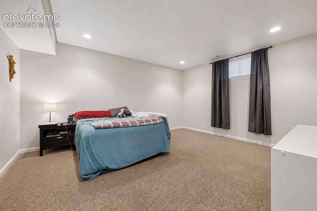 Image 19 of 24: basement bedroom