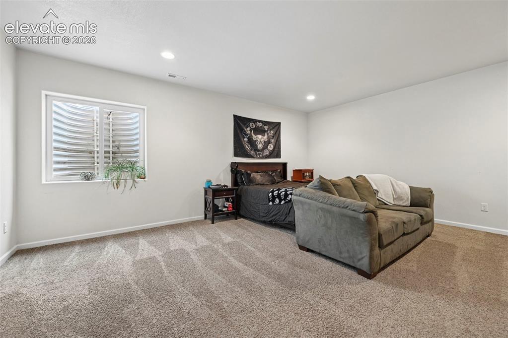 Image 20 of 24: basement bedroom
