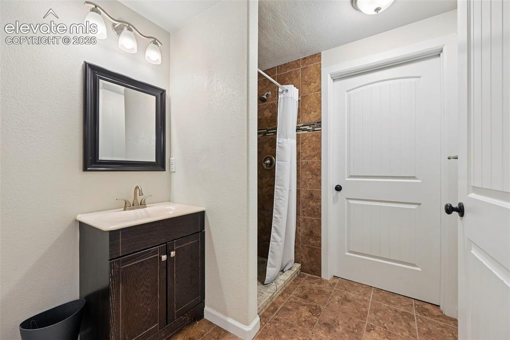 Image 21 of 24: basement bathroom