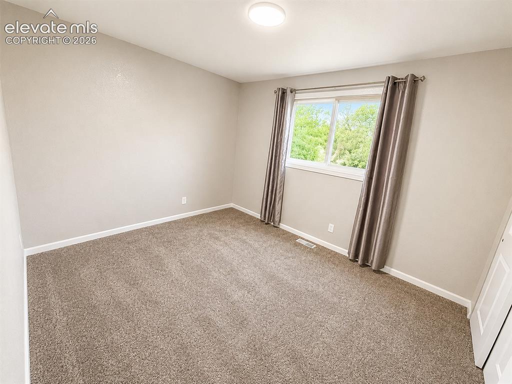 Image 11 of 30: Upper level Bedroom
