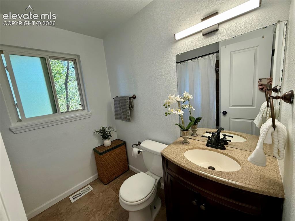 Image 13 of 30: Upper level bathroom