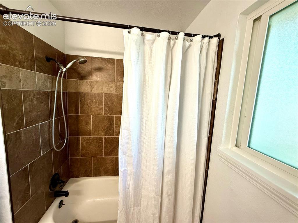 Image 14 of 30: Upper level bathroom