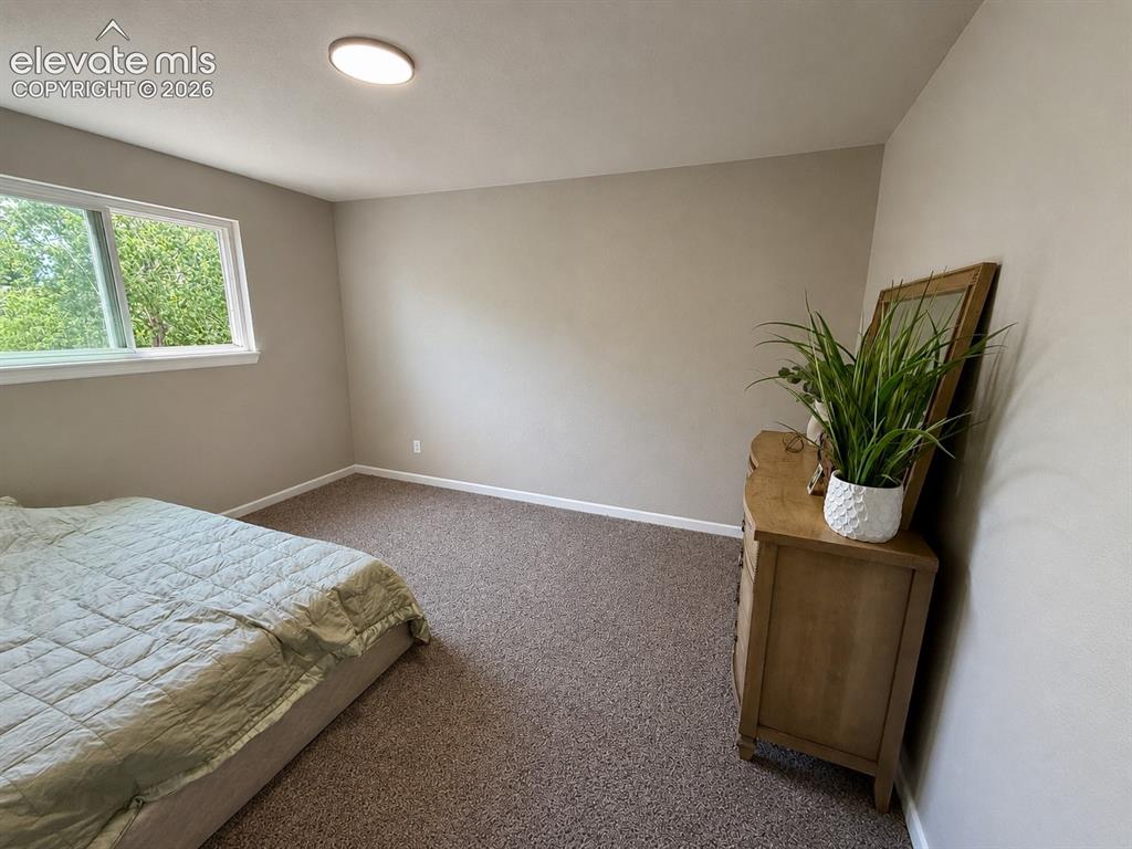 Image 17 of 30: Upper level bedroom