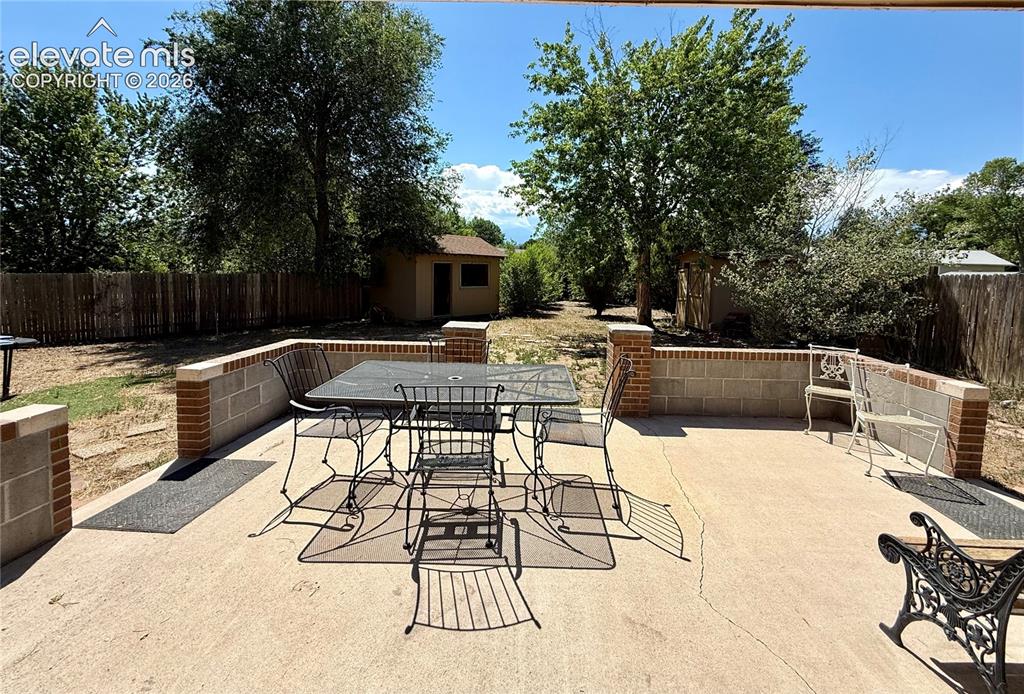 Image 28 of 30: Great backyard patio perfect for a BBQ or watching the sunset!