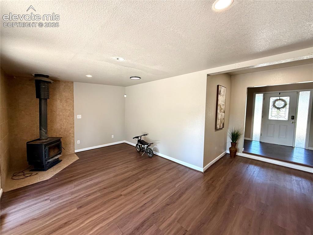 Image 4 of 30: Main level family room with fireplace