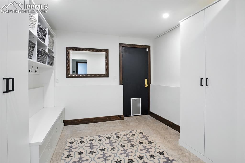 Image 47 of 50: Mudroom featuring baseboards and recessed lighting