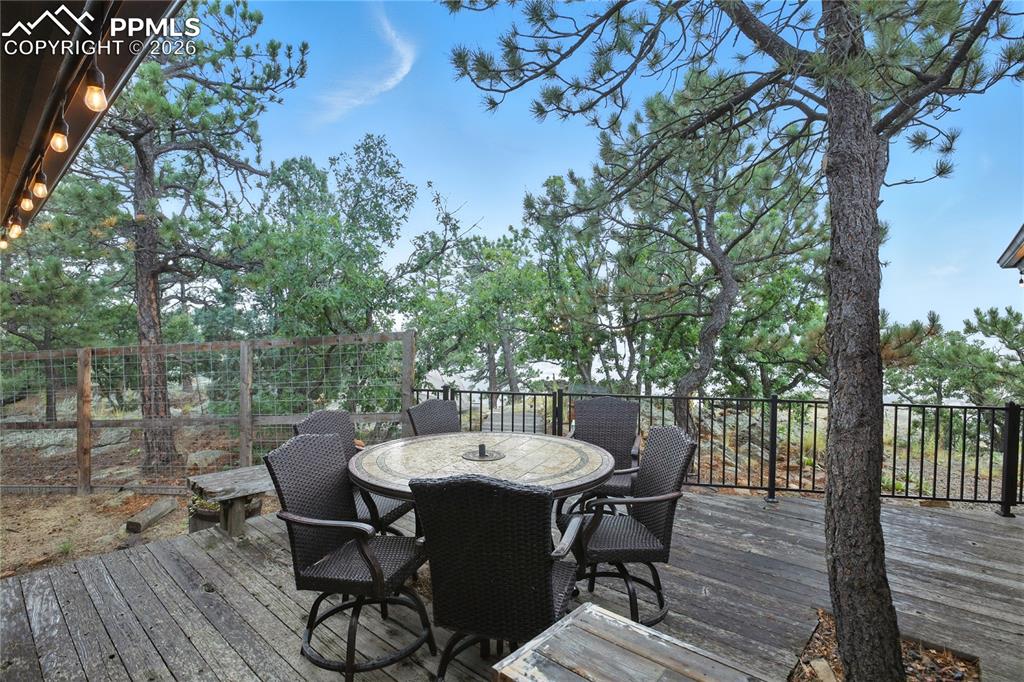 Image 50 of 50: Wooden deck with outdoor dining area