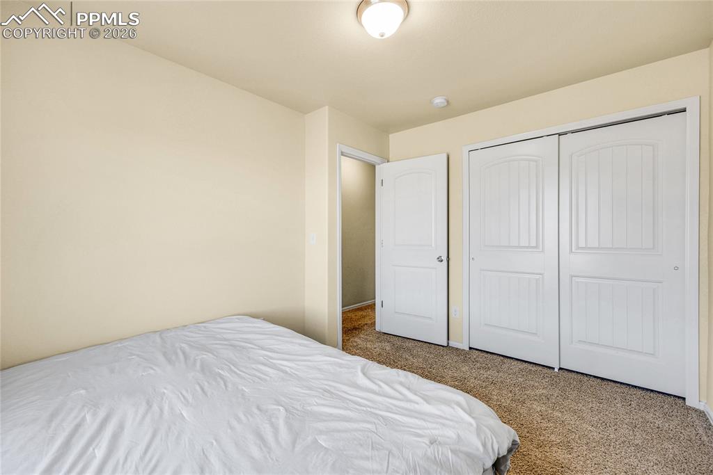 Image 21 of 32: Bedroom with generous closet space and neutral tones

