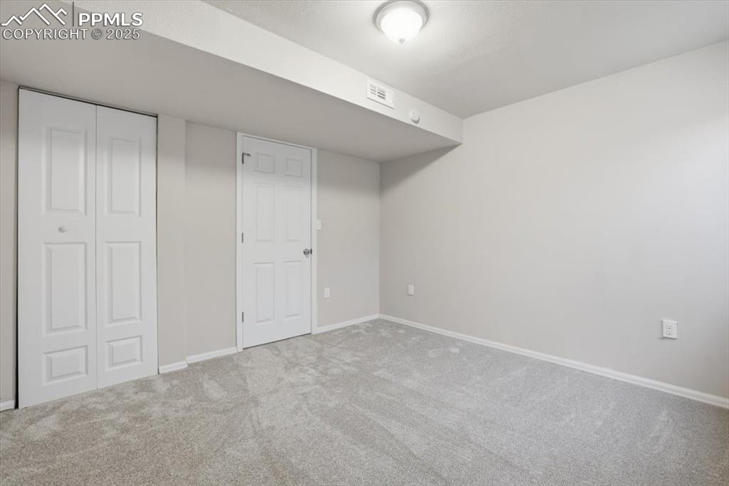 Image 34 of 48: Unfurnished bedroom featuring carpet and a closet