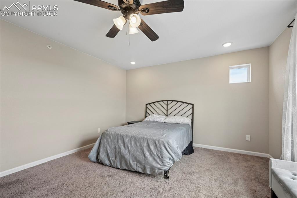 Image 15 of 42: Spacious room featuring neutral wall paint, recessed lighting, a ceiling fa
