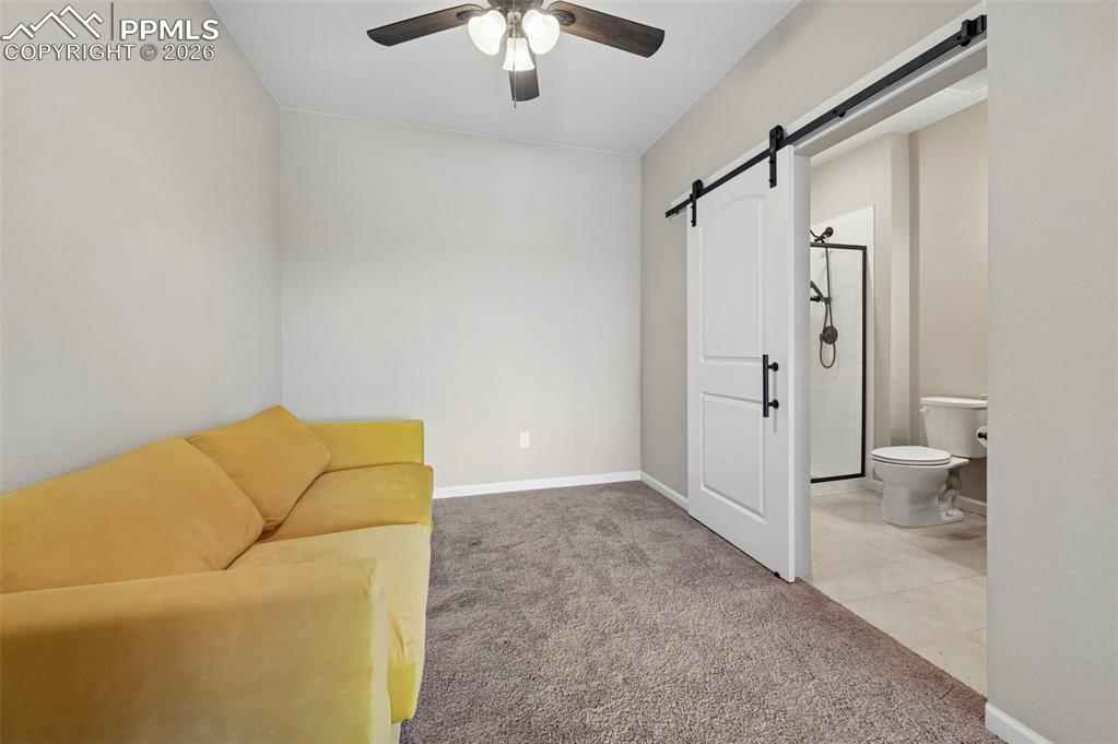Image 26 of 42: Room featuring vaulted ceiling, carpet flooring, and a ceiling fan