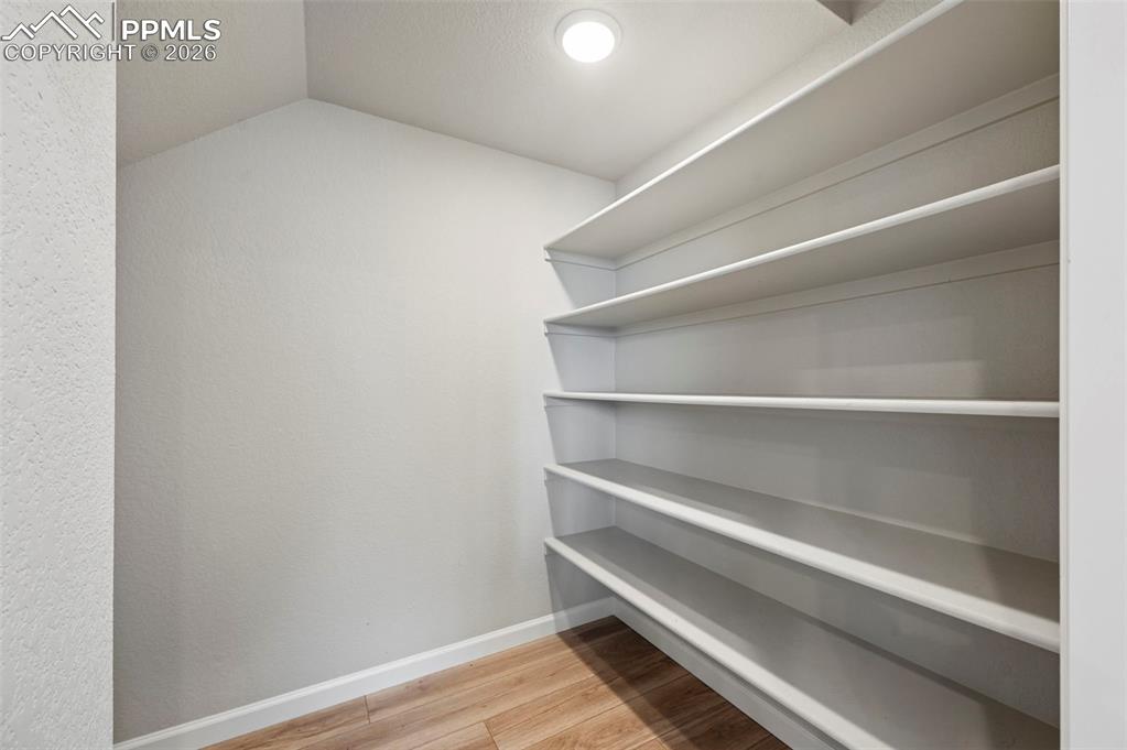 Image 31 of 42: Custom built-in shelving system featuring multiple tiers
