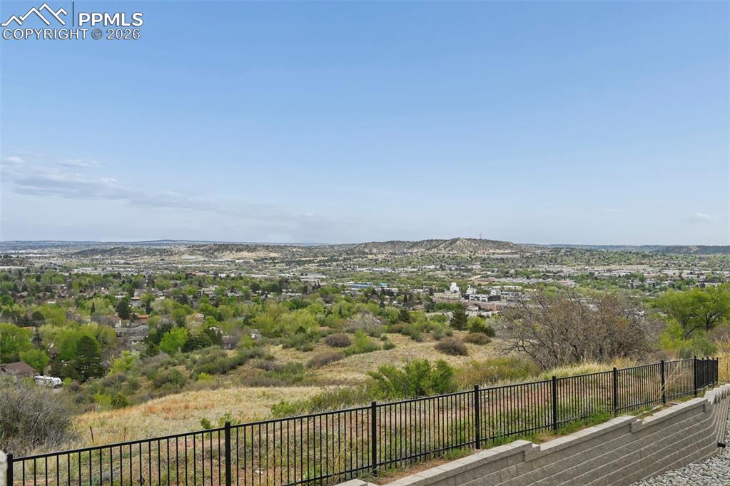 Image 37 of 42: Expansive landscape showcasing distant urban and natural elements, secured 