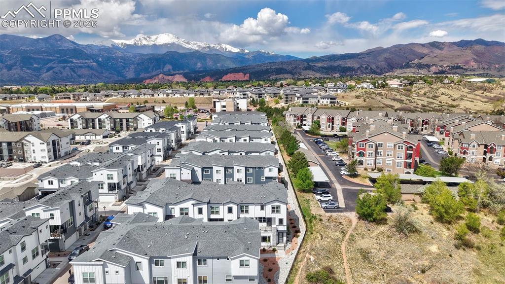 Image 38 of 42: Expansive community with varied architectural styles, featuring multi-story
