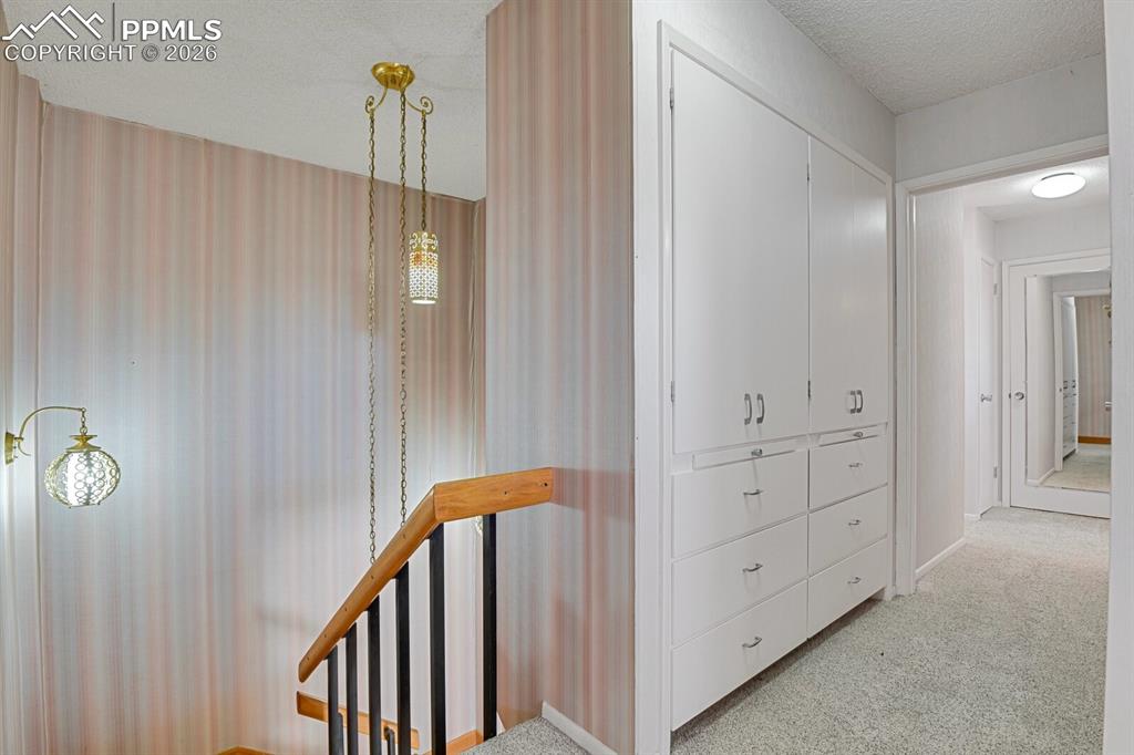 Image 19 of 49: Master Retreat Hallway w/Built-ins