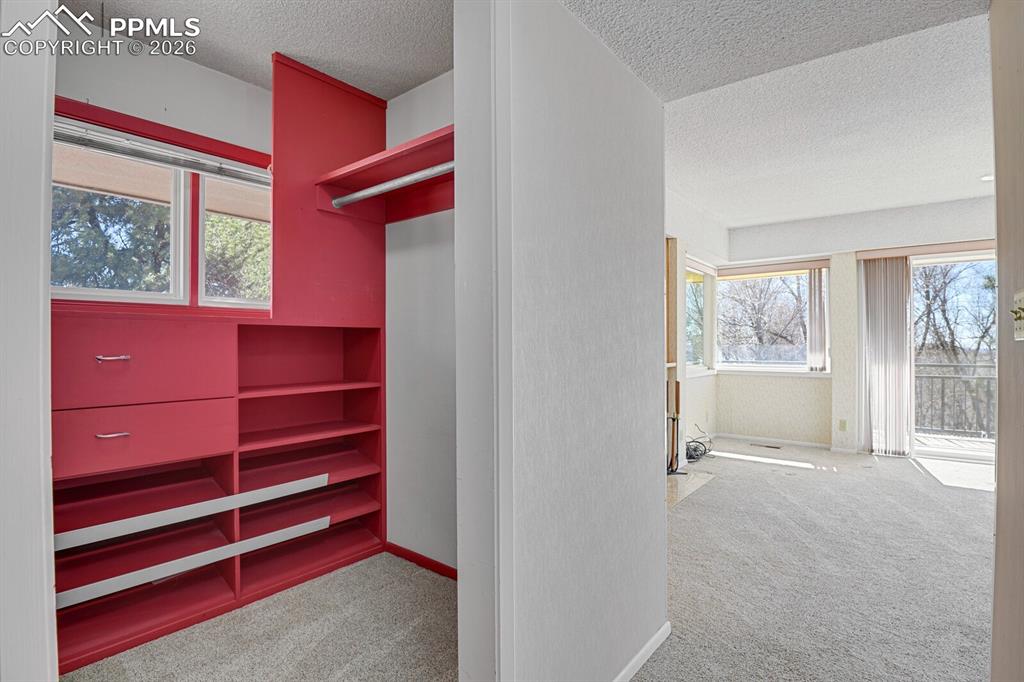 Image 26 of 49: Master Retreat Closets