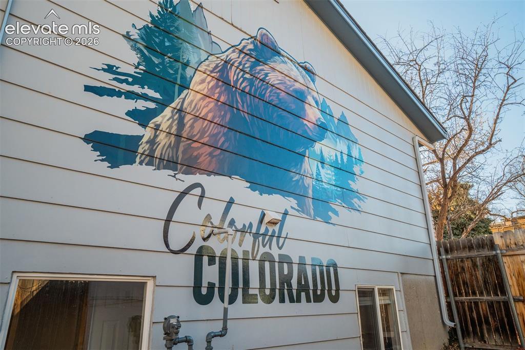 Image 39 of 50: Siding exterior featuring a large, colorful mural