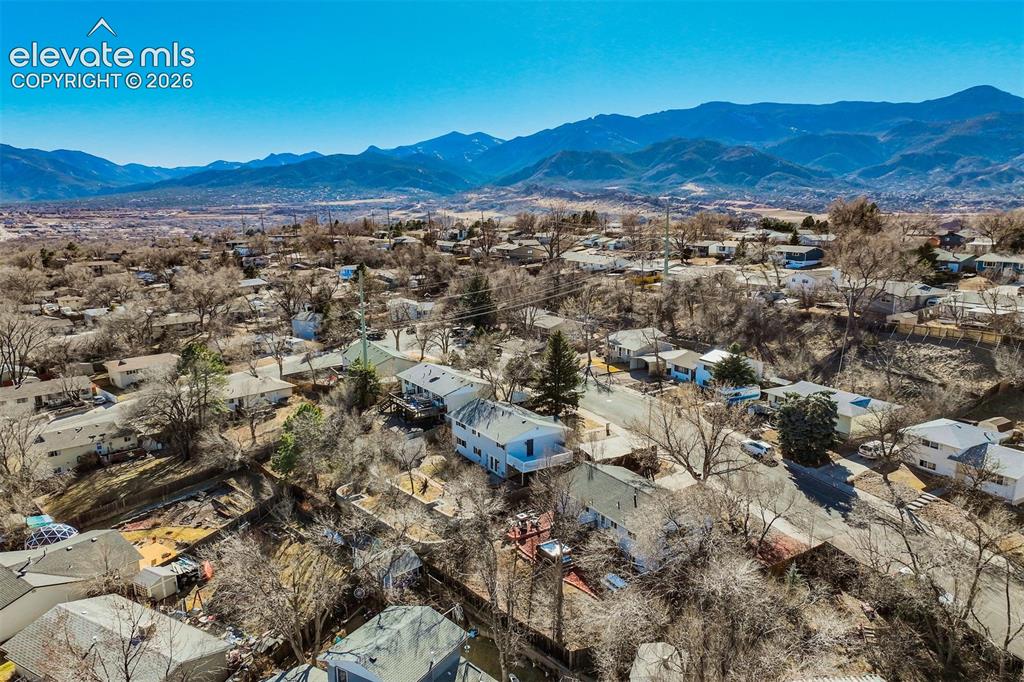 Image 46 of 50: Residential neighborhood with a mountainous backdrop