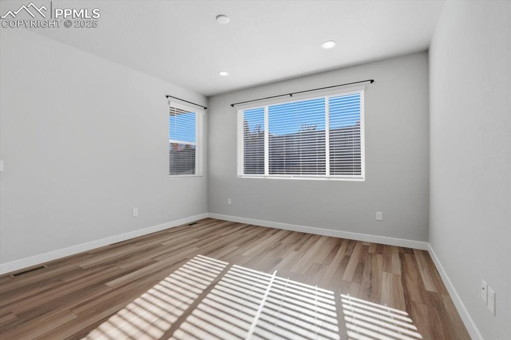 Image 11 of 34: Spare room featuring light wood finished floors and recessed lighting