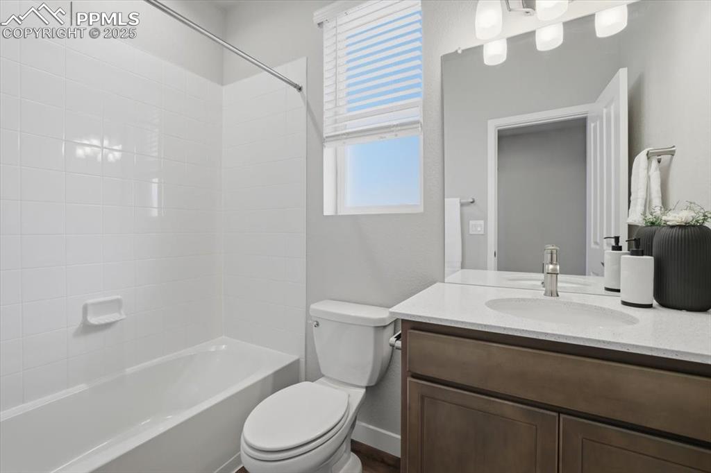 Image 21 of 34: Full bath featuring vanity and bathtub / shower combination