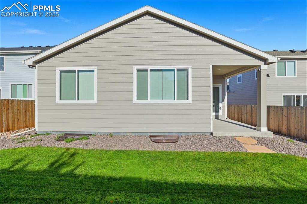 Image 31 of 34: Rear view of house featuring covered patio