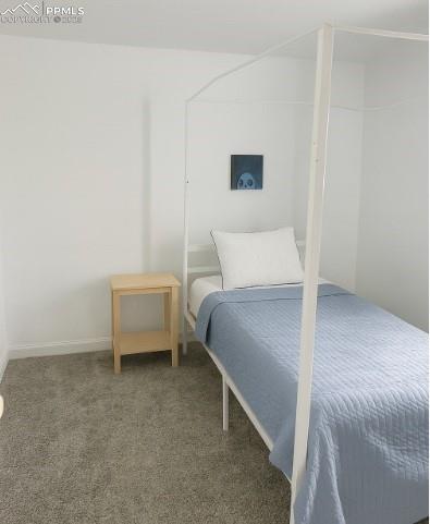 Image 8 of 9: Carpeted bedroom featuring baseboards