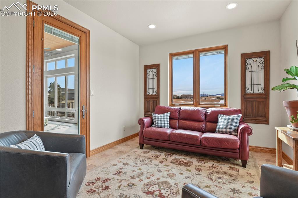 Image 16 of 50: Primary suite retreat with direct access to sun room
