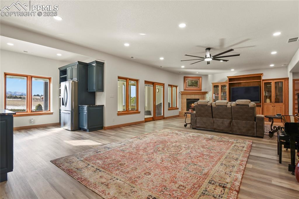 Image 23 of 50: Lower level family room, new LVP flooring and new lighting