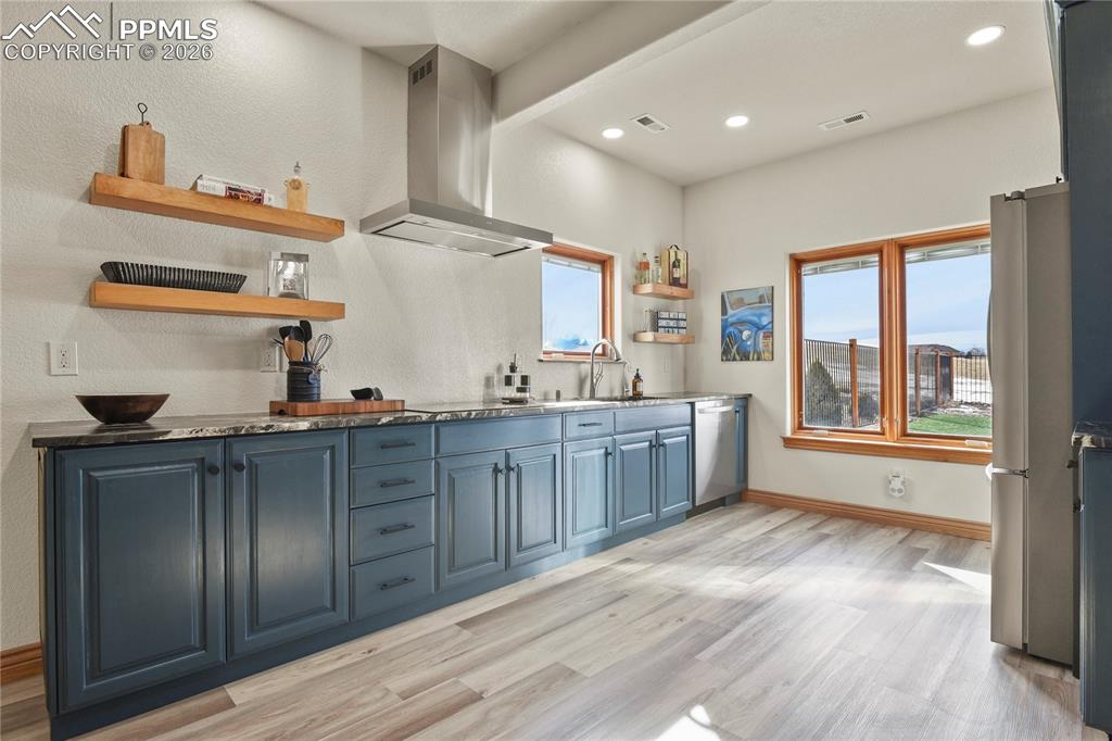 Image 24 of 50: Beautiful FULL lower level kitchen with quartzite counters, dishwasher, coo