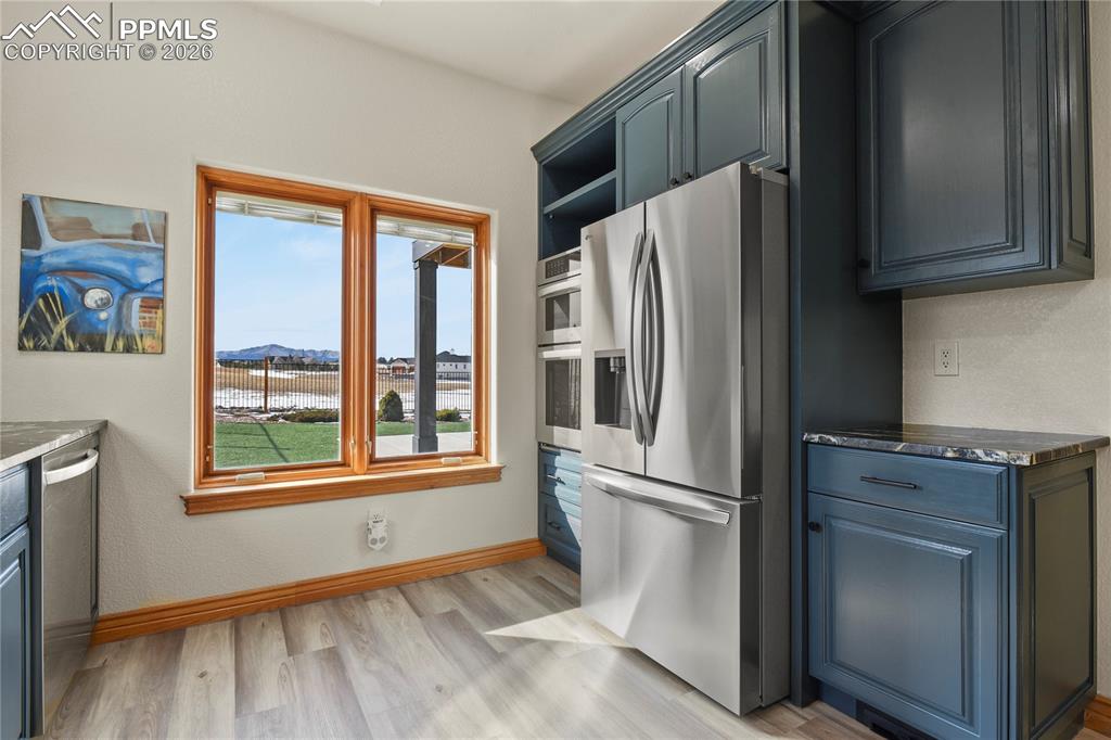 Image 25 of 50: Full size refrigerator and wall ovens