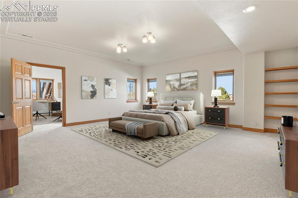 Image 27 of 50: Lower Level Secondary Suite with Sitting Area. Virtually Staged 