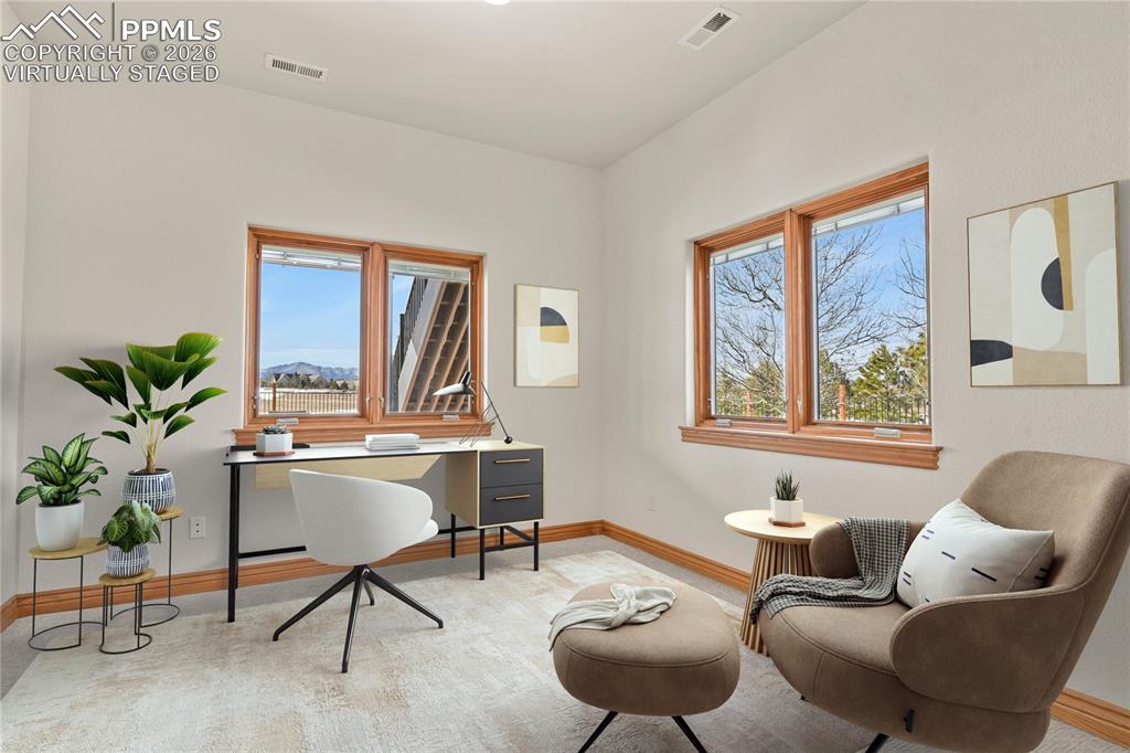 Image 29 of 50: Sitting room off secondary suite. Virtually Staged