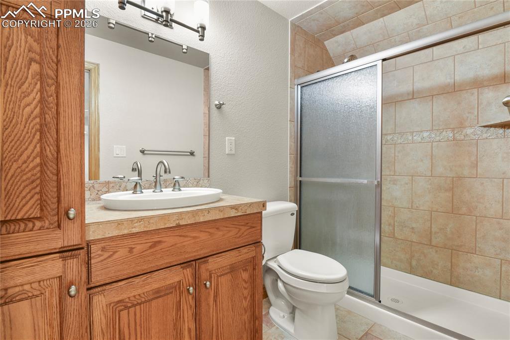 Image 36 of 50: Bath adjacent to upper level media room