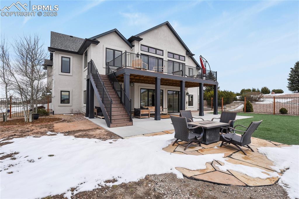 Image 40 of 50: Another view of the back yard and deck areas