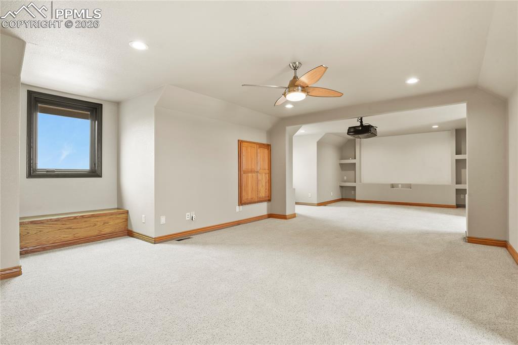 Image 44 of 50: Media/Bonus room complete with projector and equipment