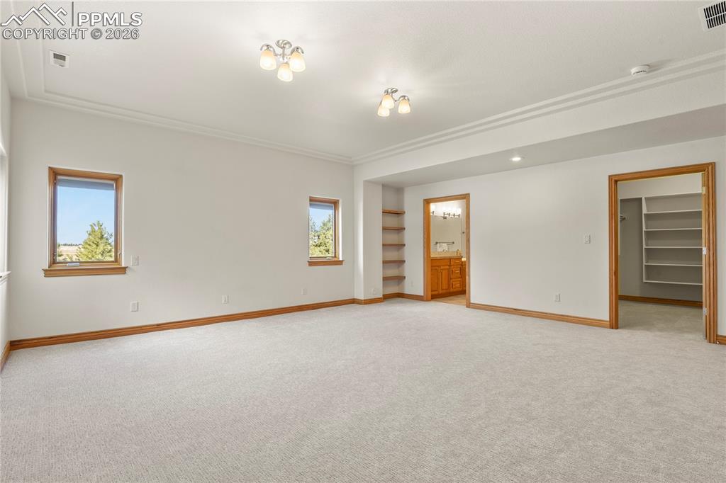 Image 46 of 50: Lower Level Suite with large walk-in closet