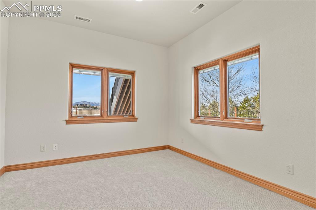 Image 47 of 50: Sitting room off secondary suite