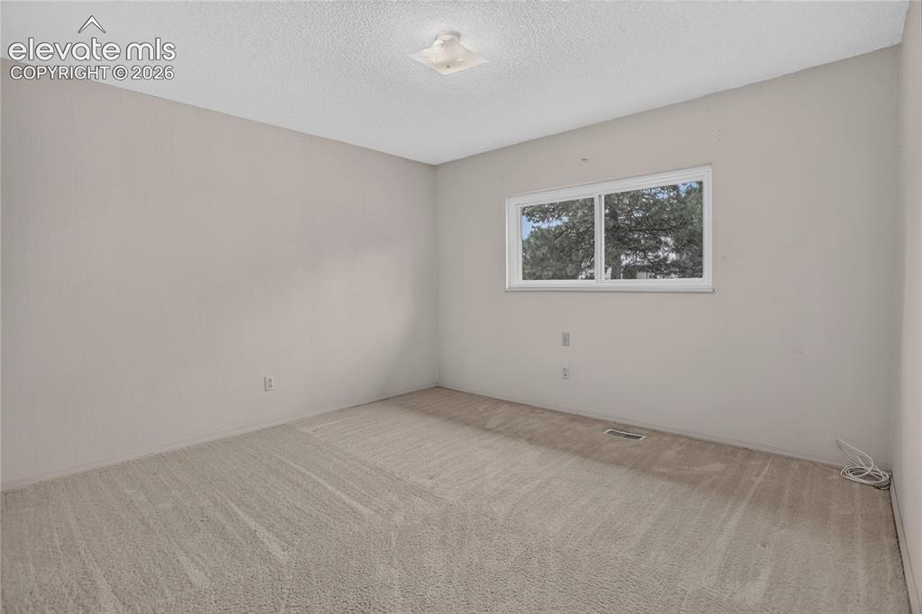 Image 14 of 21: Bedroom 3 - main level