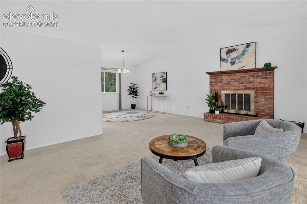 Image 4 of 21: Living room w/ fireplace